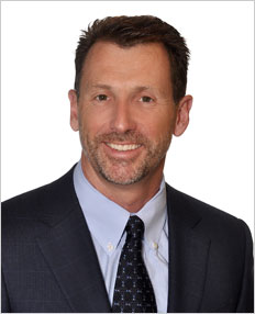 Corporate headshot of John Bennett, Executive Vice President, Sales & Business Development